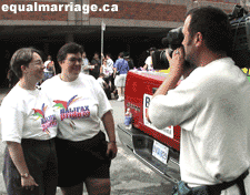Sue and Nicky Perkins being interviewed by CBC (Photo by equalmarriage.ca, 2003)