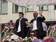 Joe Varnell and Kevin Bourassa responding to the crowd on Yonge Street (reproduced with permission  - equalmarriage.ca, 2002)