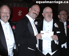 The wedding party with the marriage licence (Photo by equalmarriage.ca, 2003)