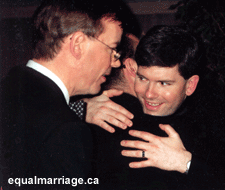 Kevin and Joe (hugging Rev. Hawkes) at home after the marriage ceremony.  (Photo by Cecile Chapelain, 2001)